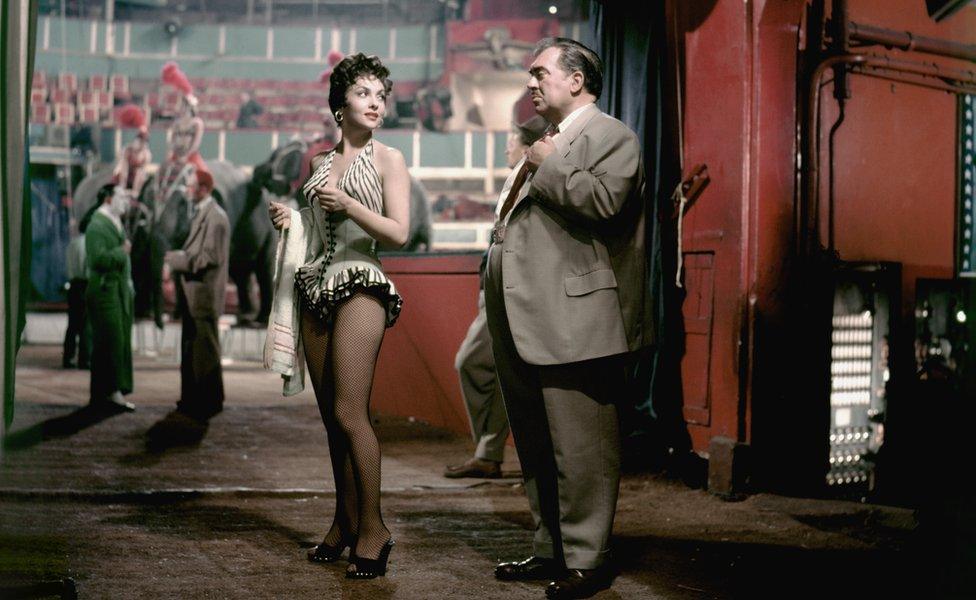 Italian actress Gina Lollobrigida and American actor Thomas Gomez on the set of Trapeze