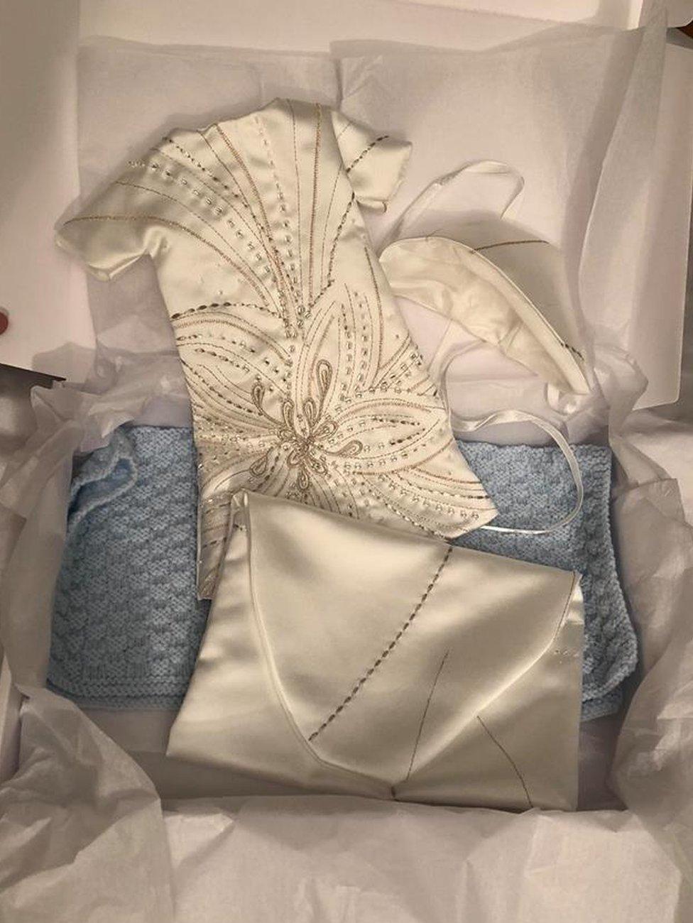 The gown sets come with a keepsake pouch for the parents