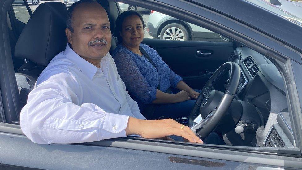 Sohail and Machrina Ejaz charging their Nissan Leaf at Toddington Services