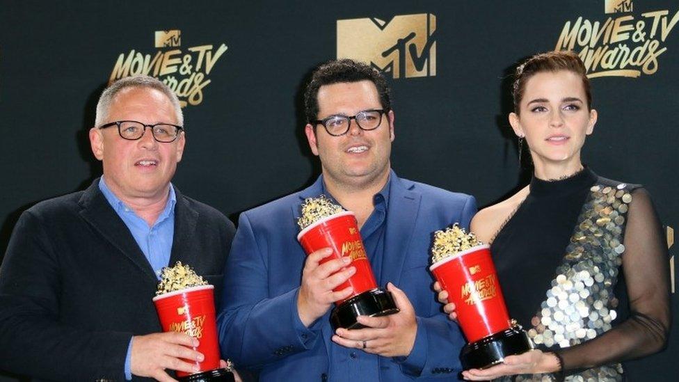 Director Bill Condon (L) stands with actors Josh Gad (C) and Emma Watson (R), winners of Movie of the Year for "Beauty and the Beast" in the press room during the 2017 MTV Movie ^ TV Awards at the Shrine Auditorium in Los Angeles, California, May 7, 2017.