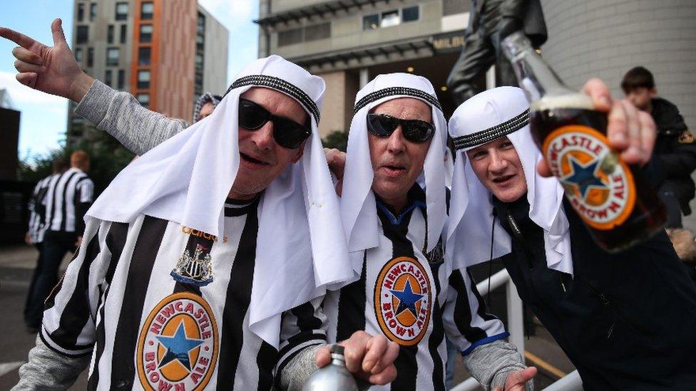 Newcastle fans with Newcastle Brown Ale after Saudi-led consortium take over