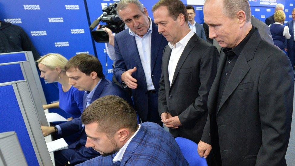 President Vladimir Putin (right) and PM Dmitry Medvedev (second from right) at United Russia election HQ, 18 Sep 16