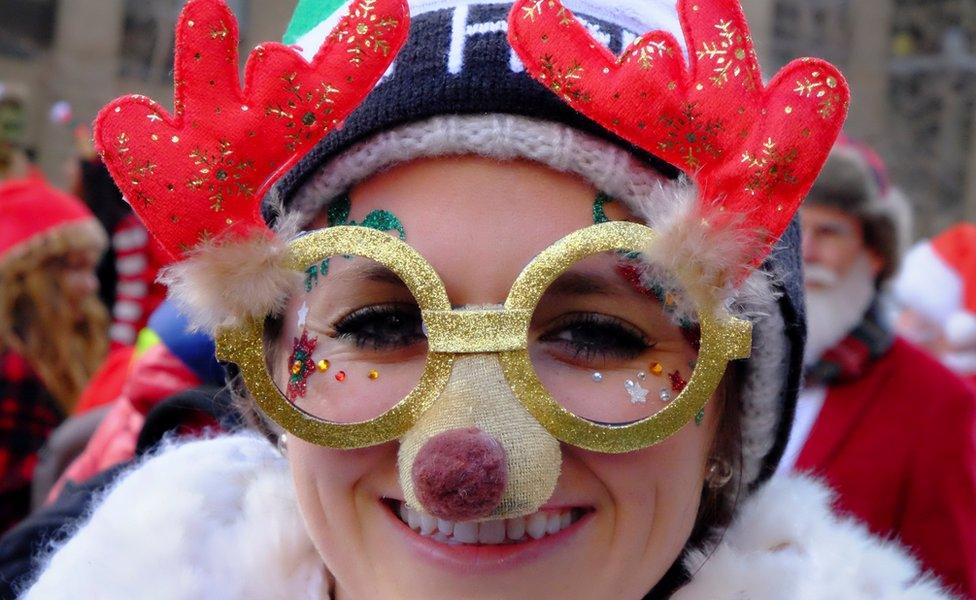 A reveller sports seasonal decorations in the annual SantaCon event in Manhattan, New York, December 10, 2016