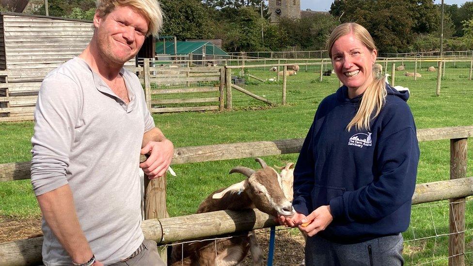 Two staff members at an animal sanctuary