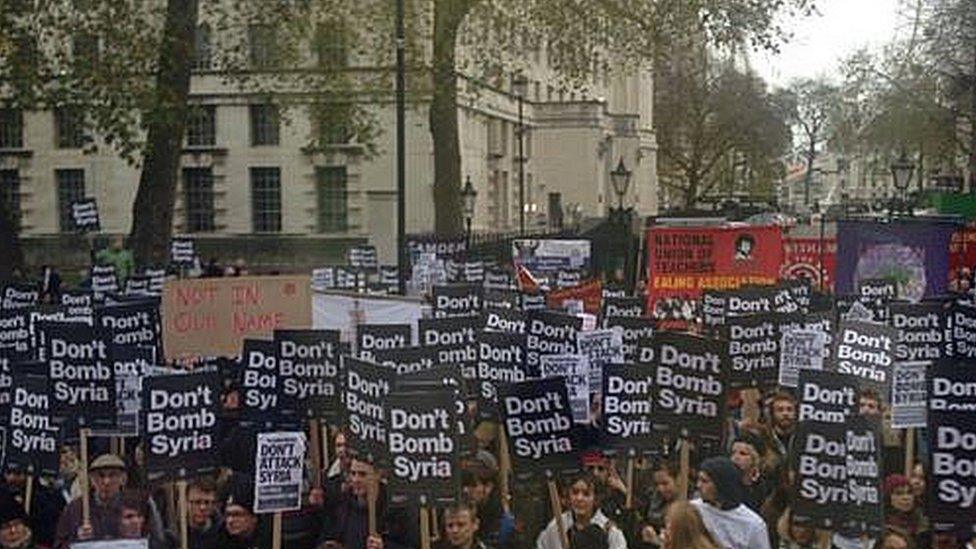 Protesters gathered holding signs declaring "Don't bomb Syria"