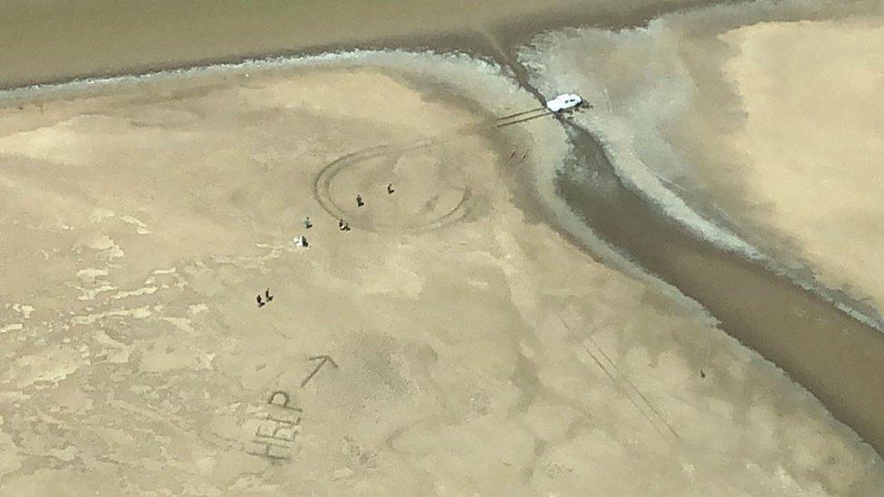 Aerial image of a help sign made by a stranded couple in Keep River National Park