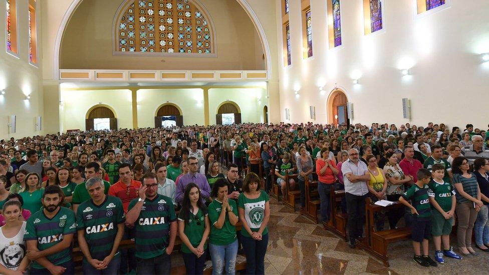 Fans at a church service in Chapeco