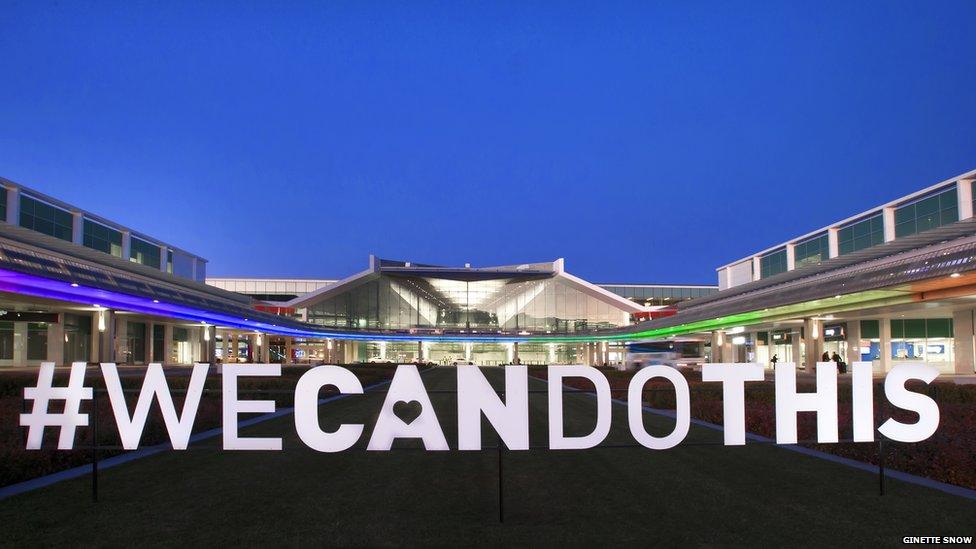 Canberra Airport with a WECANDOTHIS sign in front of it