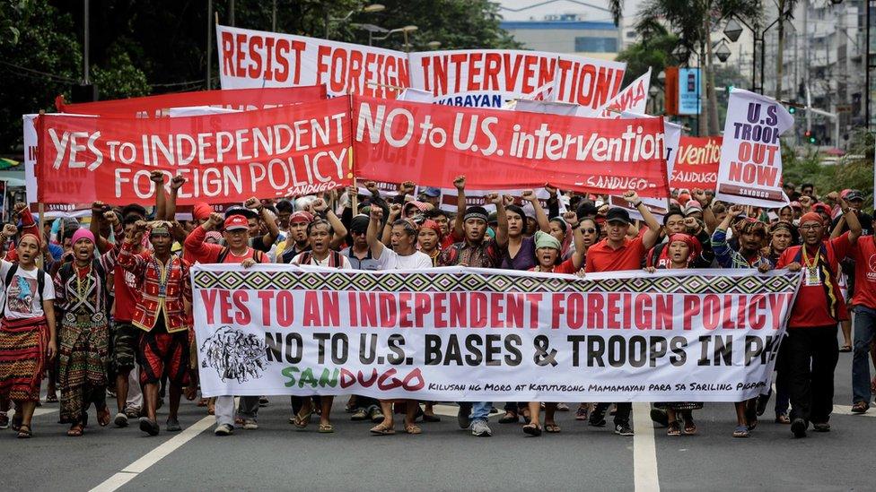 Filipino protesters march towards the US Embassy in Manila, Philippines, 19 October 2016