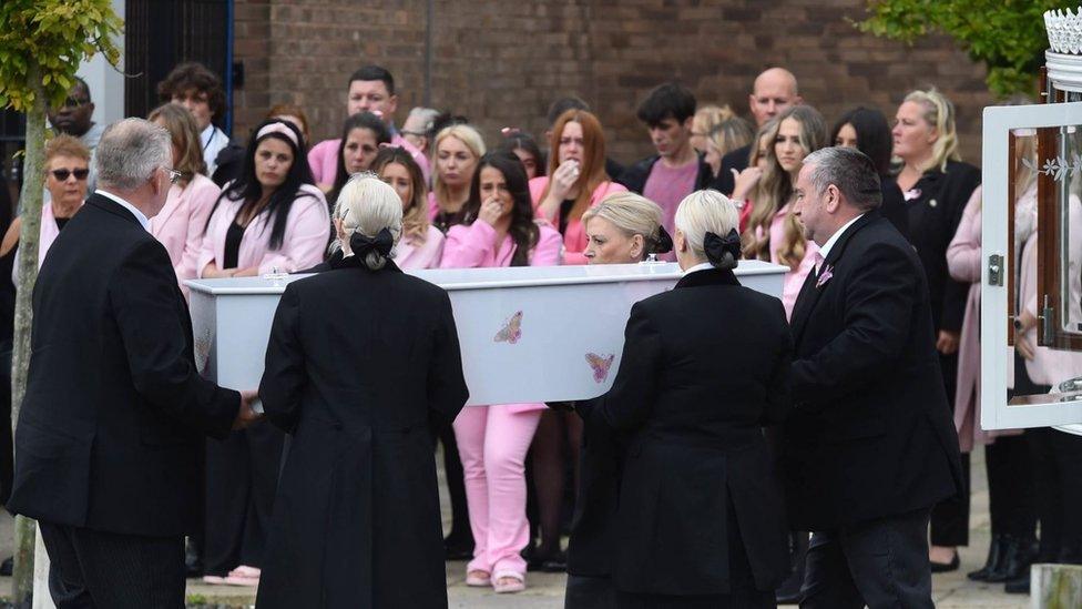 Mourners wear pink in memory of the nine-year-old