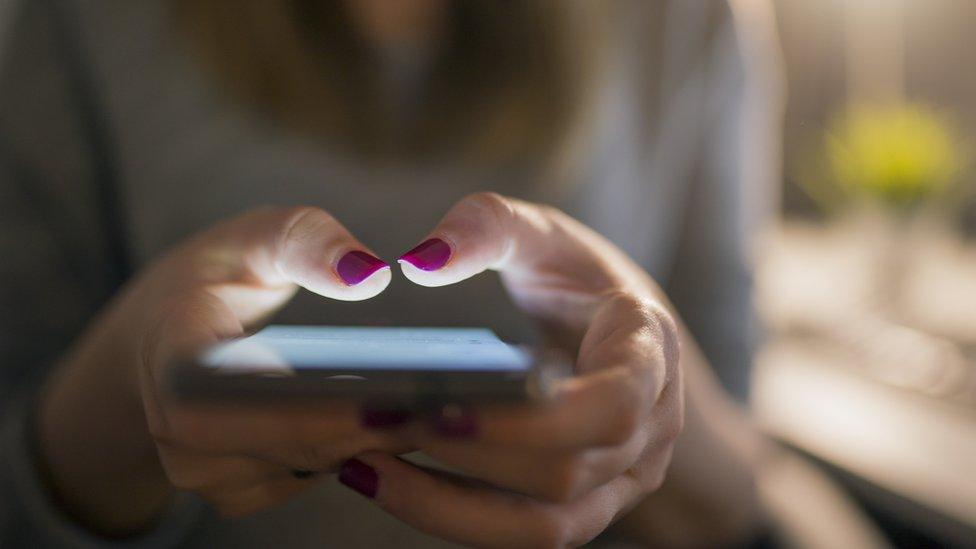 A woman using her phone