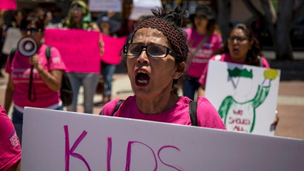 A protester against Trump's immigration policies in Tijuana, Mexico