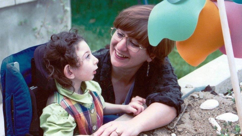 Josephine as a young girl in the garden with her mother