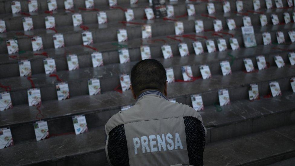 The credentials of journalists killed in Mexico are laid out at a memorial in Guadalajara in 2017