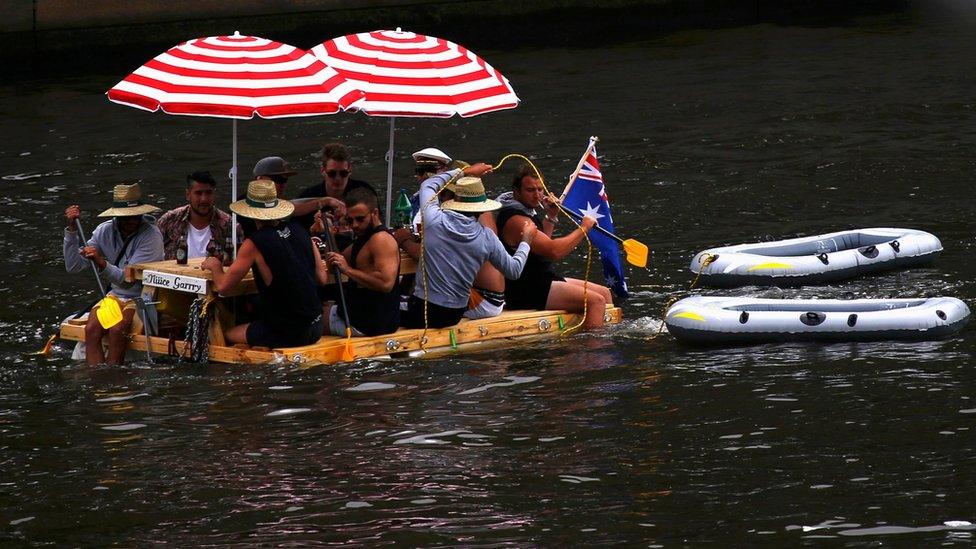 A group of people float on a makeshift raft, as they celebrate Australia Day, along the Yarra River in Melbourne, Australia 26 January 2017