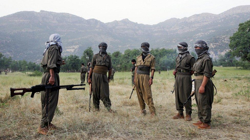 PKK fighters chat during a training exercise in northern Iraq on 20 June 2007