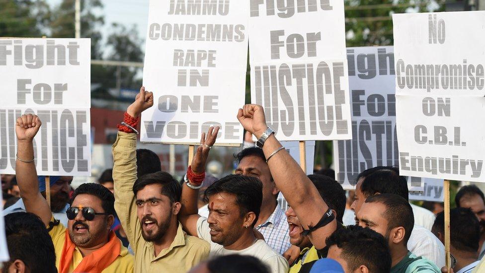 Indian supporters of Bharatiya Janata Party (BJP) leader Chaudhary Lal Singh, who resigned from the state cabinet over the Kathua rape, hold placards during a rally in support of a new probe led by the federal Central Bureau of Investigation (CBI)