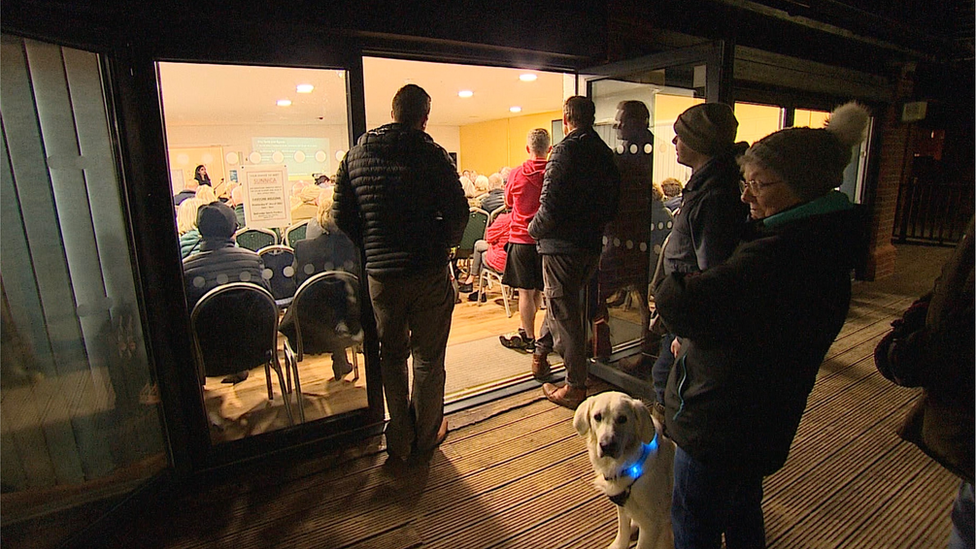 Residents stood outside solar farm meeting