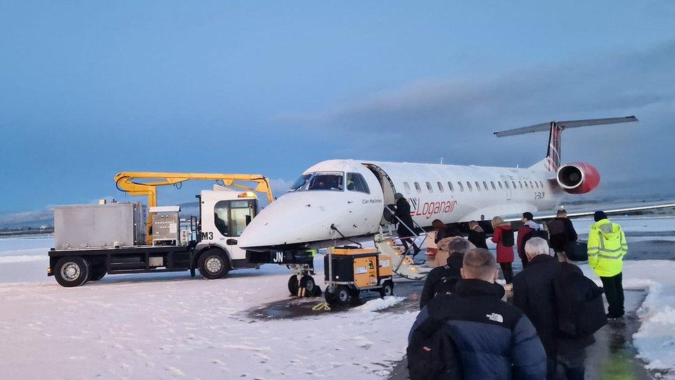 flight waiting to take off in snow at city of derry