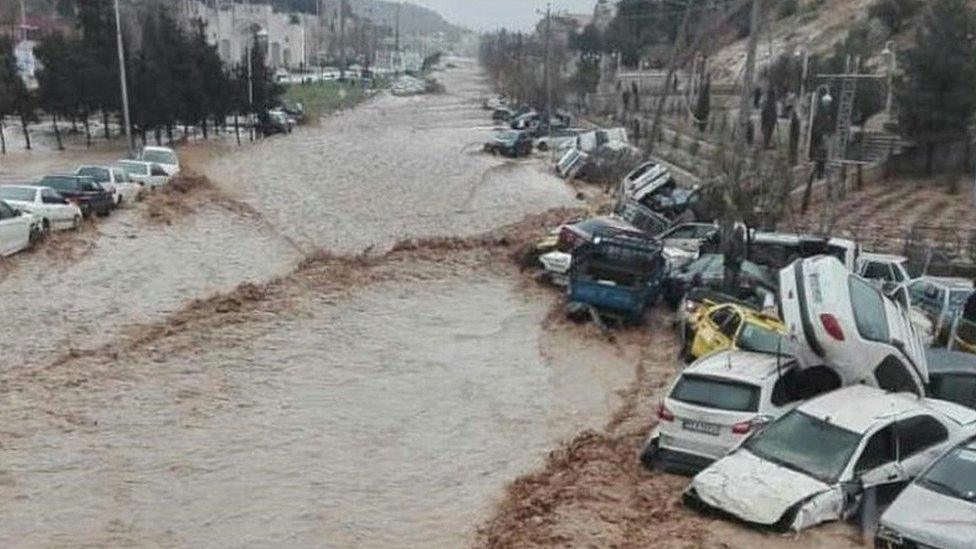 Vehicles are stacked one against another after a flash flooding In Shiraz, Iran, March 25, 2019