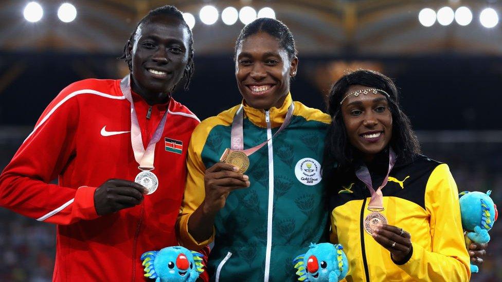 L-R) Silver medalist Margaret Nyairera Wambui of Kenya, gold medalist Caster Semenya of South Africa and bronze medalist Natoya Goule of Jamaica pose during the medal ceremony for the Womens 800 metres during athletics on day nine of the Gold Coast 2018 Commonwealth Games at Carrara Stadium