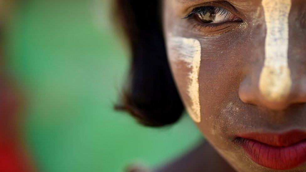 Rohingya refugee Shamima, aged 10, poses for a photograph as she wears thanaka paste at Jamtoli camp in Cox's Bazaar, Bangladesh