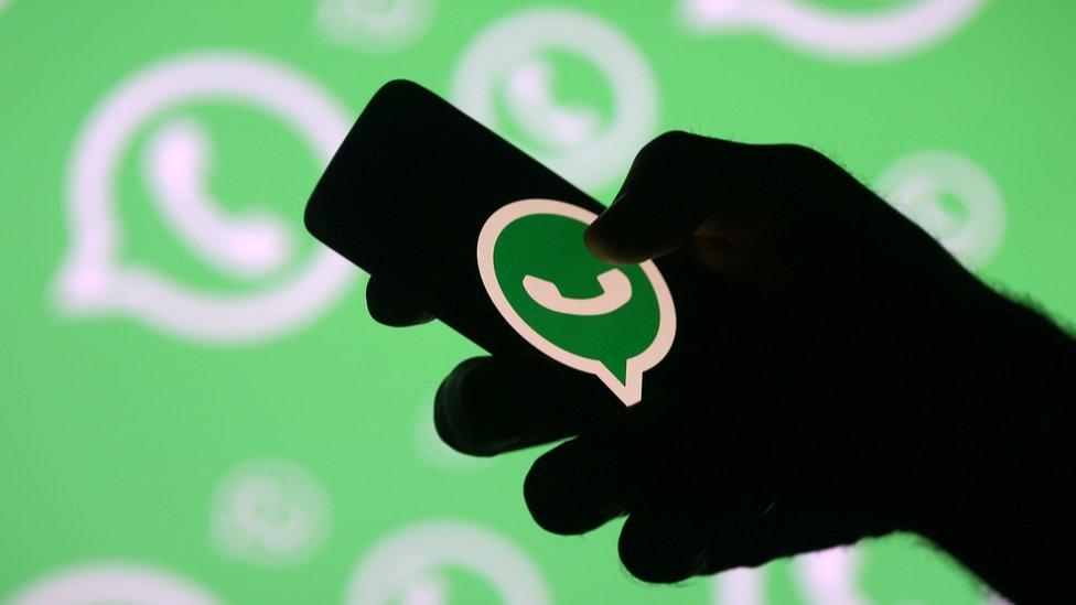 WhatsApp logo on a phone