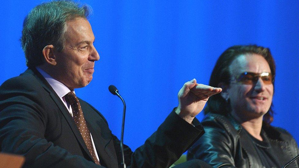 Tony Blair and U2 singer Bono talking at WEF in 2005