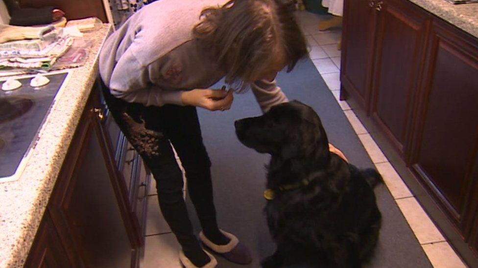 Rowena and her dog Emma in the kitchen