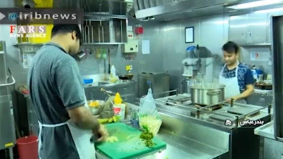 Cooks in the kitchen of the Stena Impero