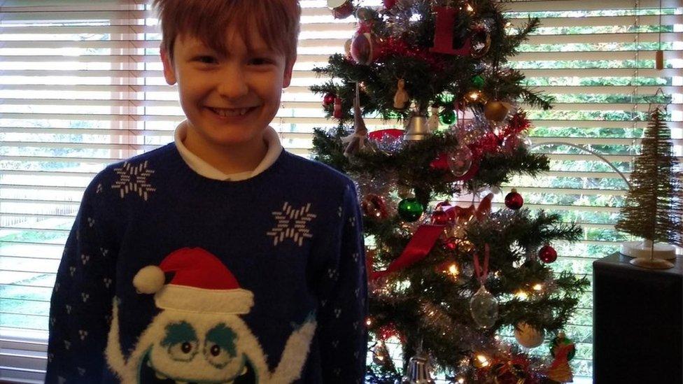 Boy in Christmas jumper.