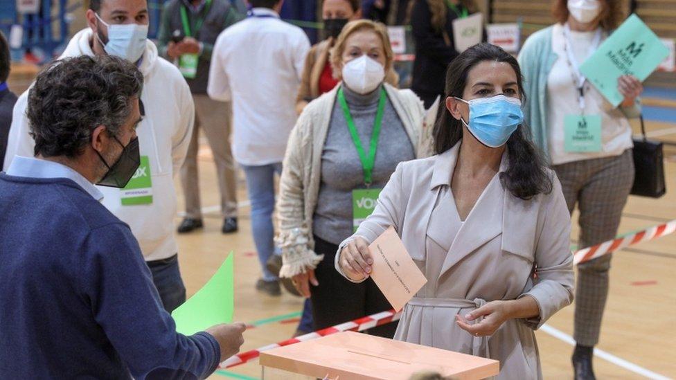 Rocio Monasterio (R) casts her vote during the Madrid election