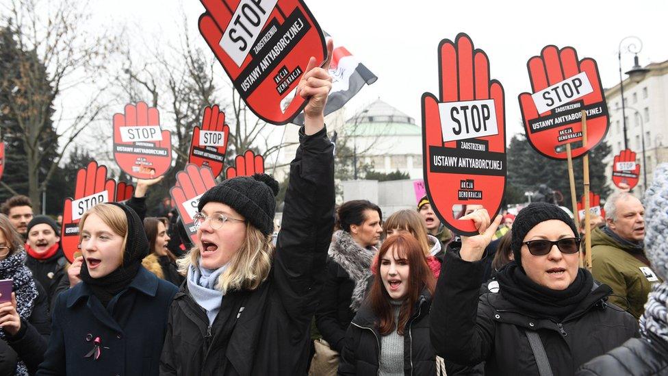 People take part in the nationwide women's strike "Black Friday