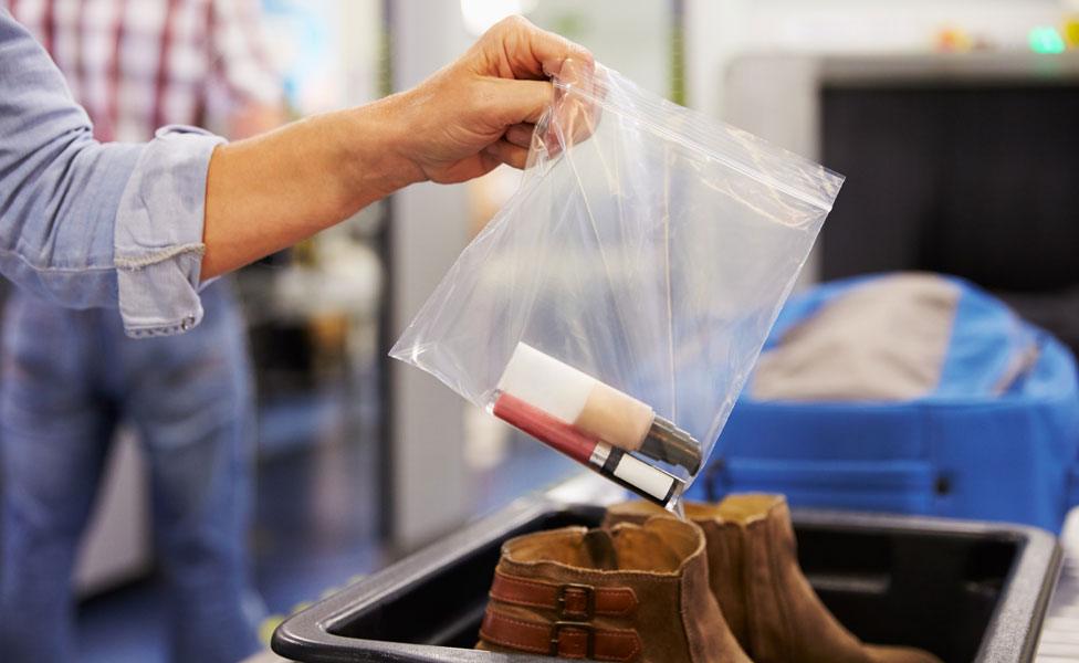 Liquids in a plastic bag being put into the airport security check