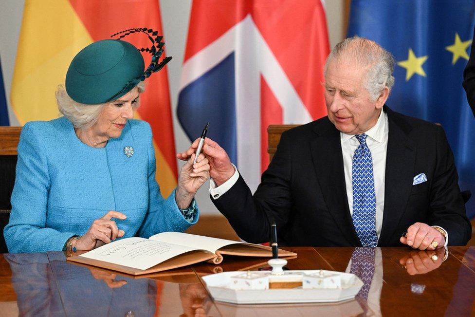 King Charles III and Camilla Queen Consort sign the Golden Book as they visit Schloss Bellevue and attend meeting with Federal President Steinmeier, Berlin