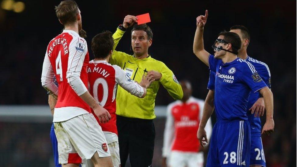 Per Mertesacker of Arsenal is shown the red card and is sent off for his challenge on Diego Costa of Chelsea