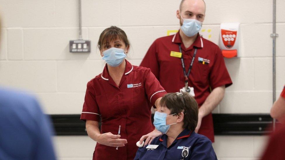 Sister Joanna Sloan is the first person in Northern Ireland to receive the first of two Pfizer/BioNTech COVID-19 vaccine jabs, at the Royal Victoria Hospital in Belfast