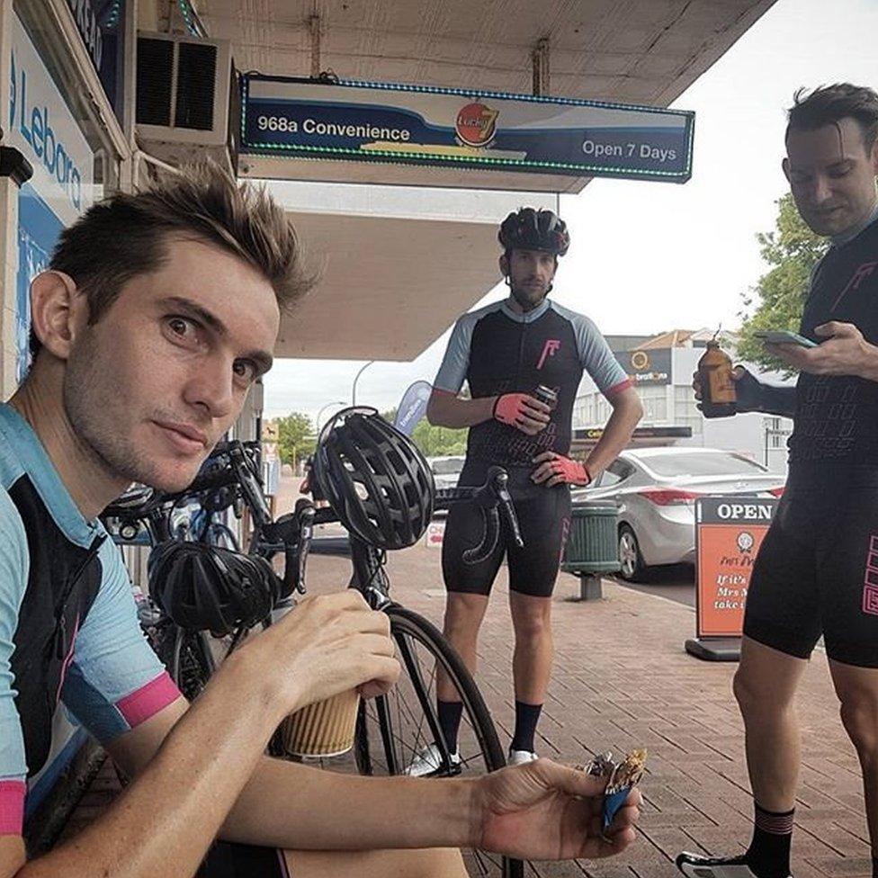 The cyclists stop for drinks and snacks midway through their ride