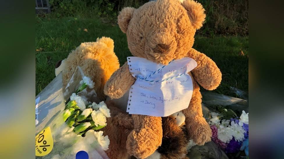 Teddy bear with handwritten note