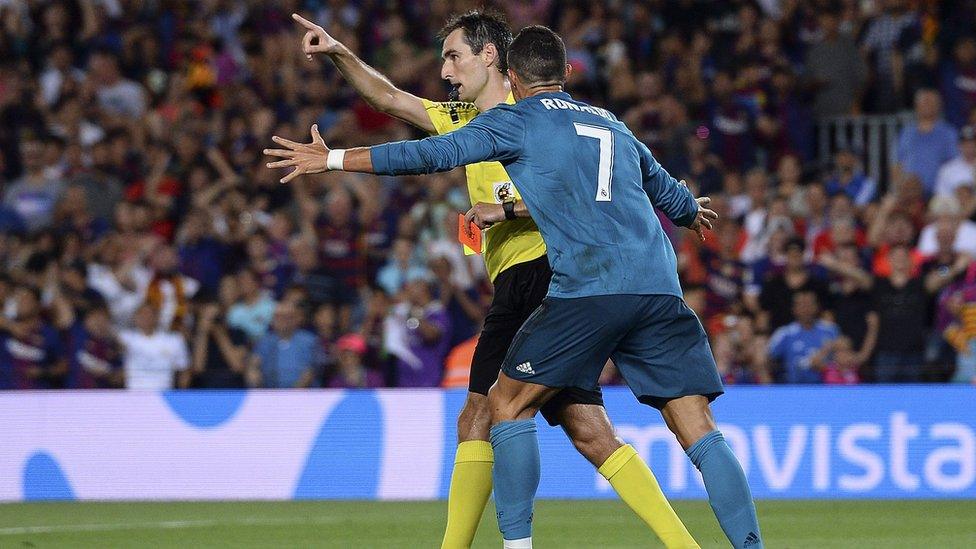 Ronaldo argues with referee