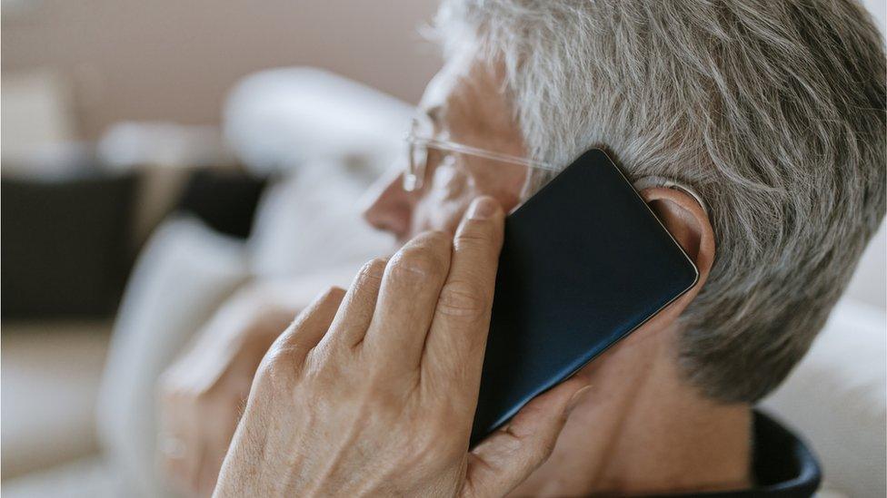 Man with mobile phone at his ear