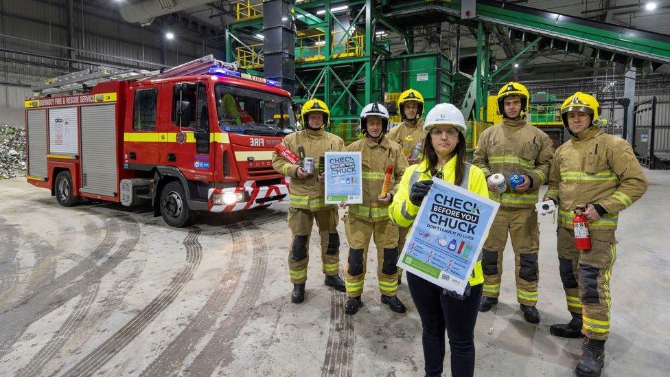 fire officers in front of fire engine