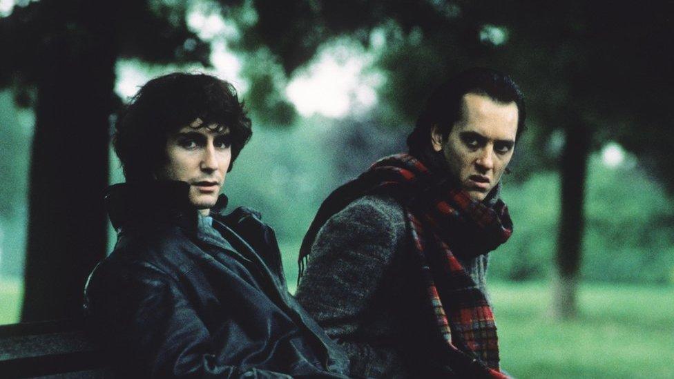 Paul McGann (left) and Richard E Grant on a park bench in the film Withnail and I