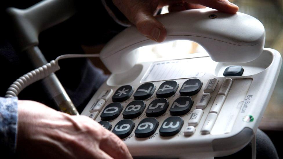 Elderly person using a phone