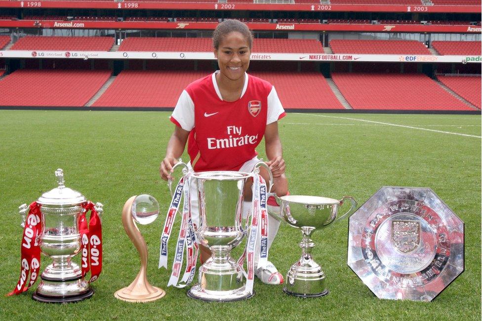 Rachael Yankey of Arsenal with the Women's FA Cup Trophy, Women's UEFA Cup Trophy, Women's League Cup Trophy, Women's Premier League Trophy and the Women's Community Shield