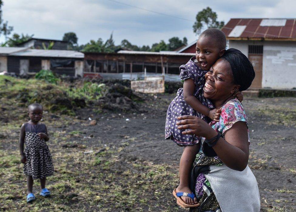 Woman holding a child