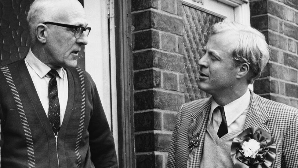 British politician Nicholas Winterton (right), Conservative candidate for Macclesfield, talking to Mr Frank Bushell on his doorstep as he canvasses prior to the by-election, England, September 29th 1971