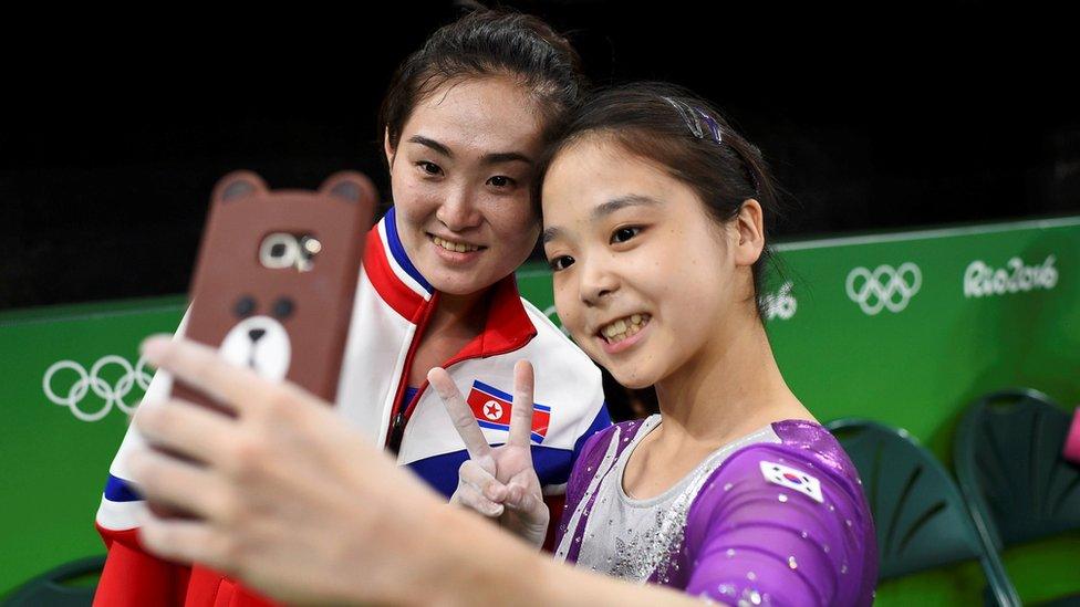 Lee Eun-Ju of South Korea takes a selfie with Hong Un Jong of North Korea, during Gymnastics training at the Rio Olympic Arena, Rio de Janeiro, Brazil, August 2016