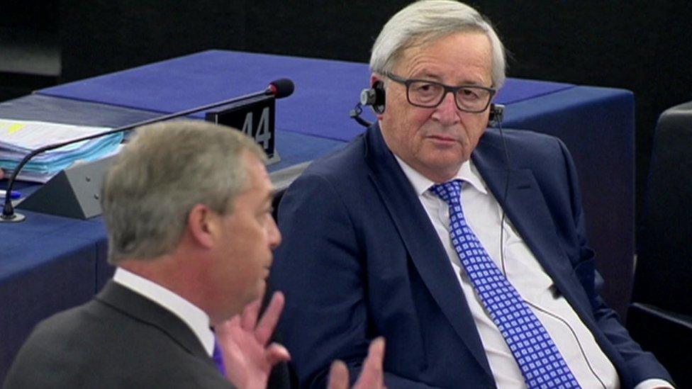 Jean-Claude Juncker listens to Nigel Farage