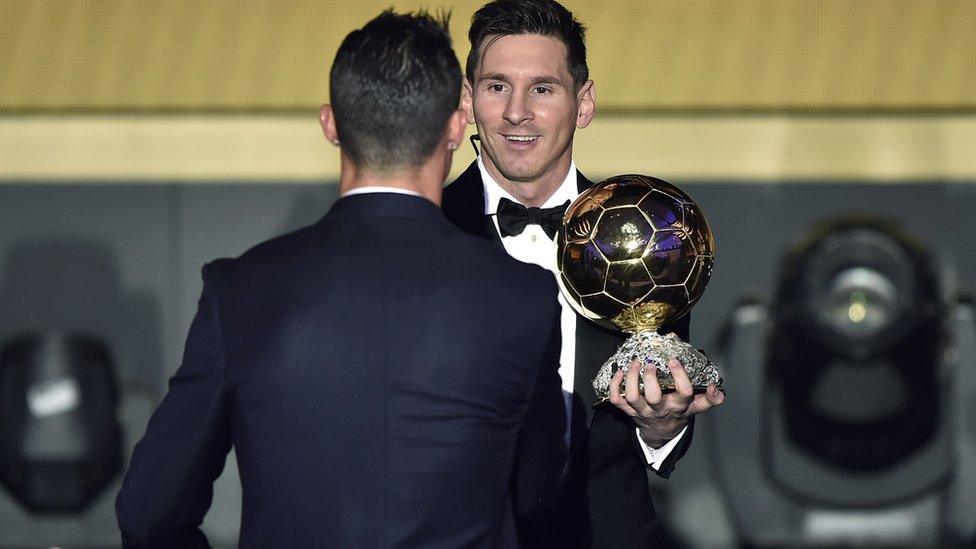 Cristiano Ronaldo shakes hands with Lionel Messi